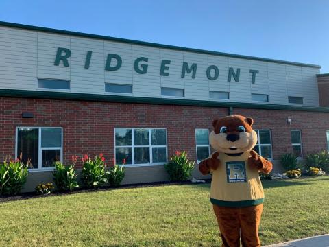 gopher mascot standing in front of the Ridgemont school